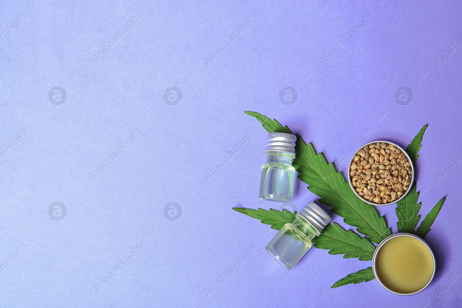 Photo of Flat lay composition with hemp lotion and space for text on color background