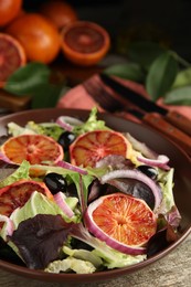Photo of Bowldelicious sicilian orange salad on wooden table, closeup