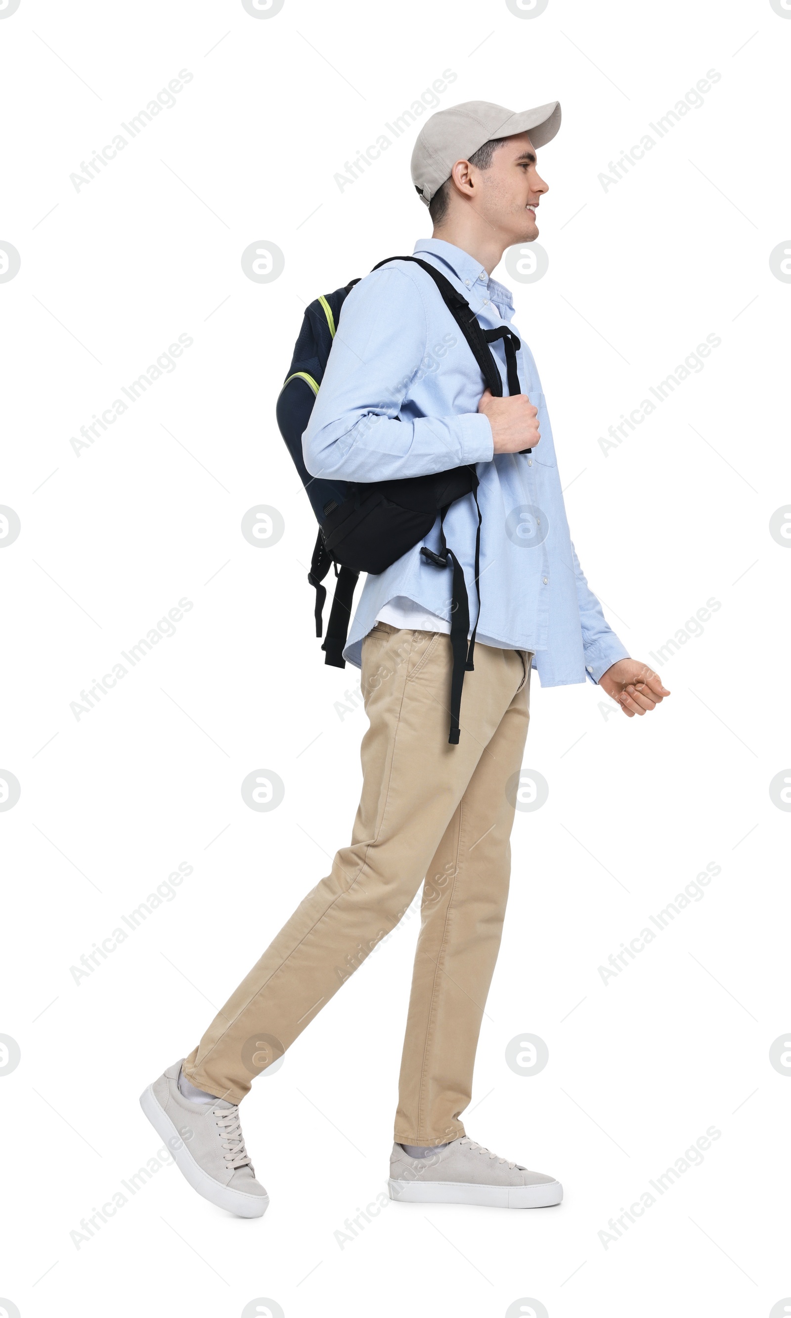 Photo of Young man with cap and backpack on white background