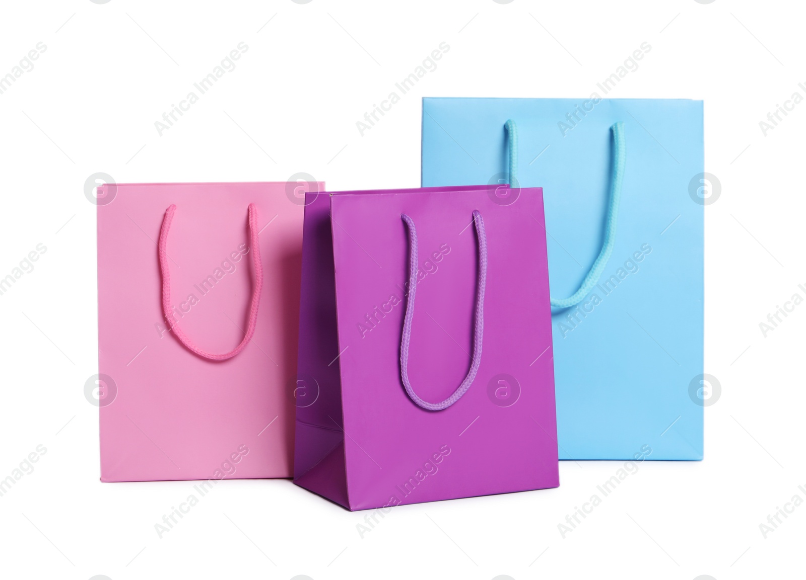 Photo of Colorful paper shopping bags isolated on white