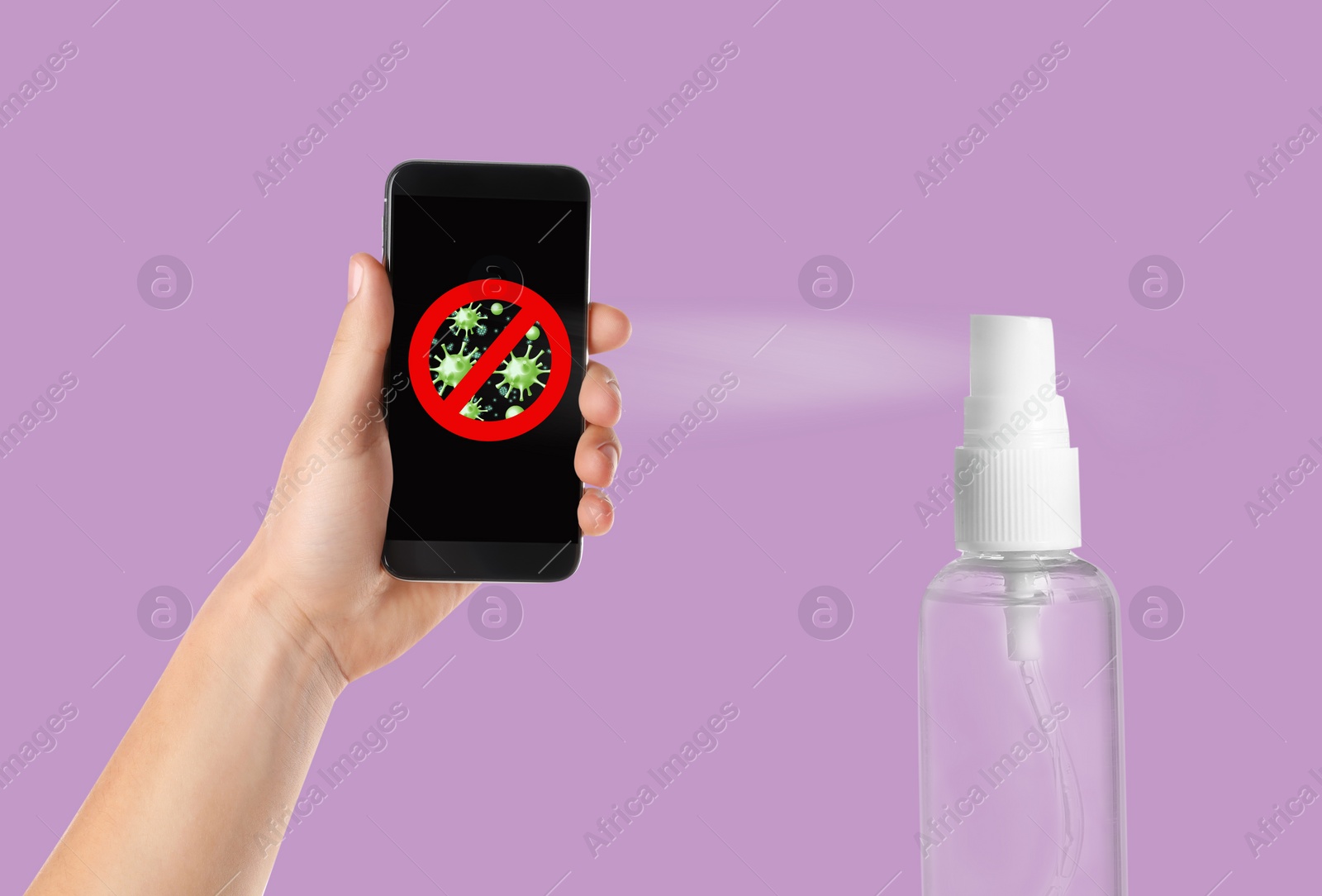 Image of Sanitizing mobile devices during coronavirus outbreak. Antiseptic spray and man with smartphone on lilac background, closeup