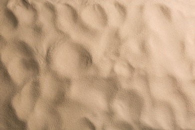 Photo of Dry beach sand as background, top view