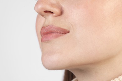 Photo of Woman with dry skin on white background, closeup view