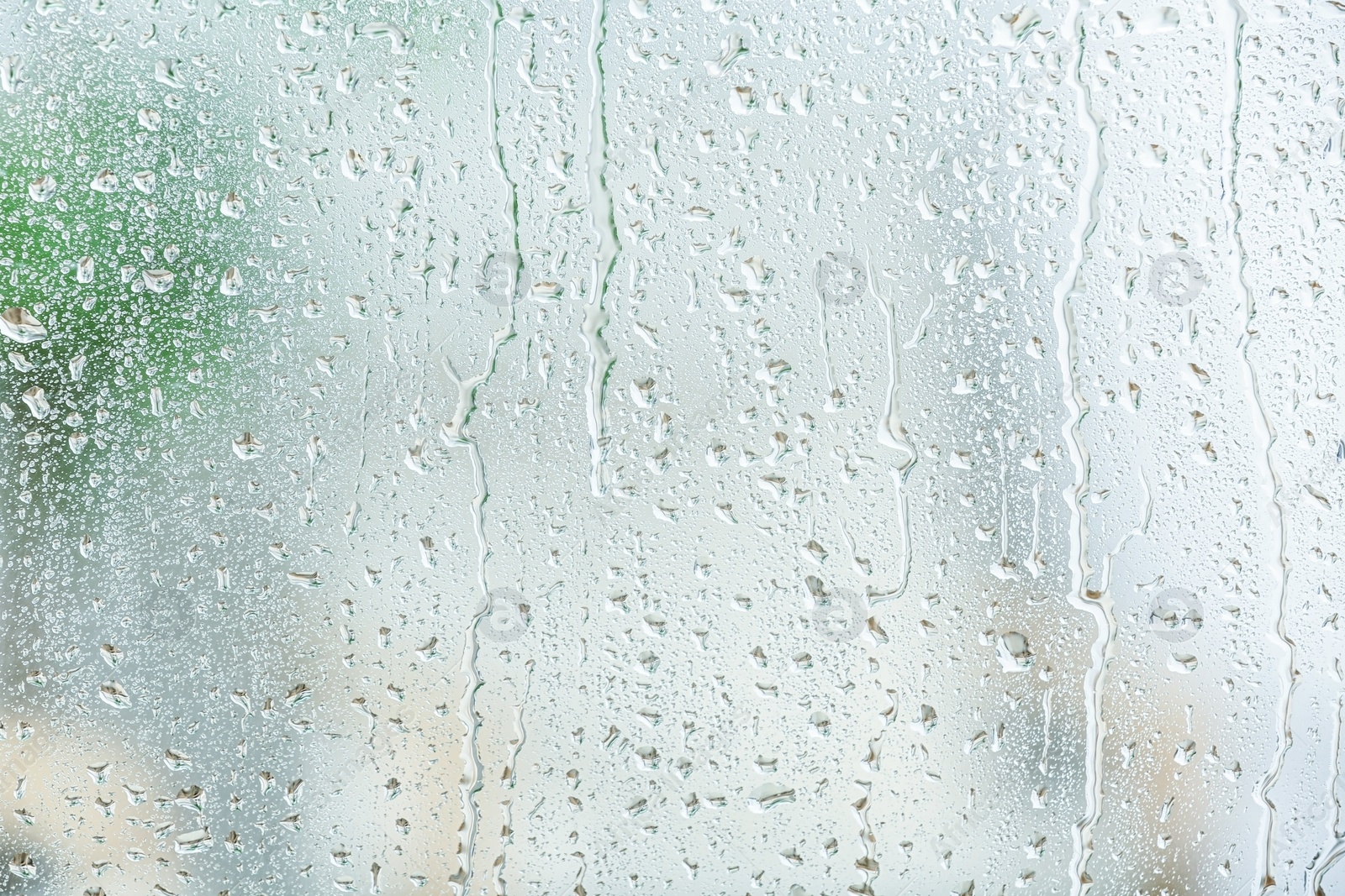 Photo of View of glass with water drops, closeup