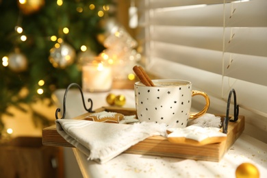 Photo of Composition with cup of hot drink on windowsill