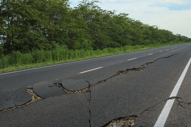 Image of Large cracks on asphalt road after earthquake