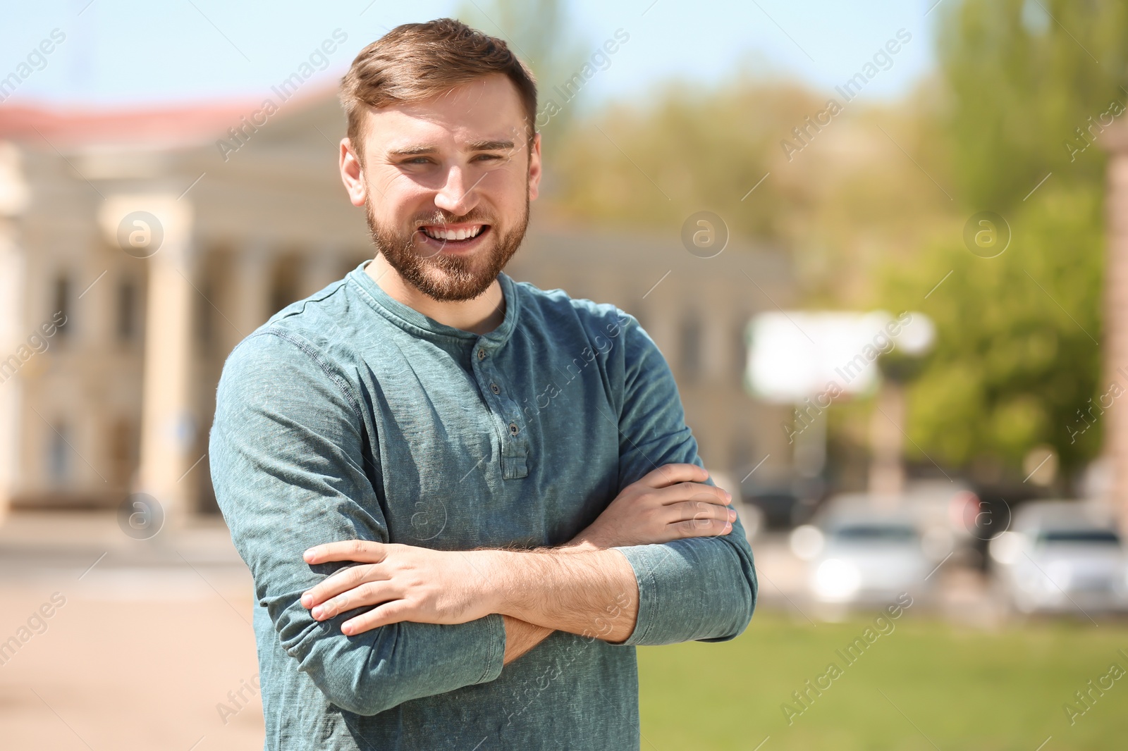 Photo of Portrait of young man in stylish outfit outdoors