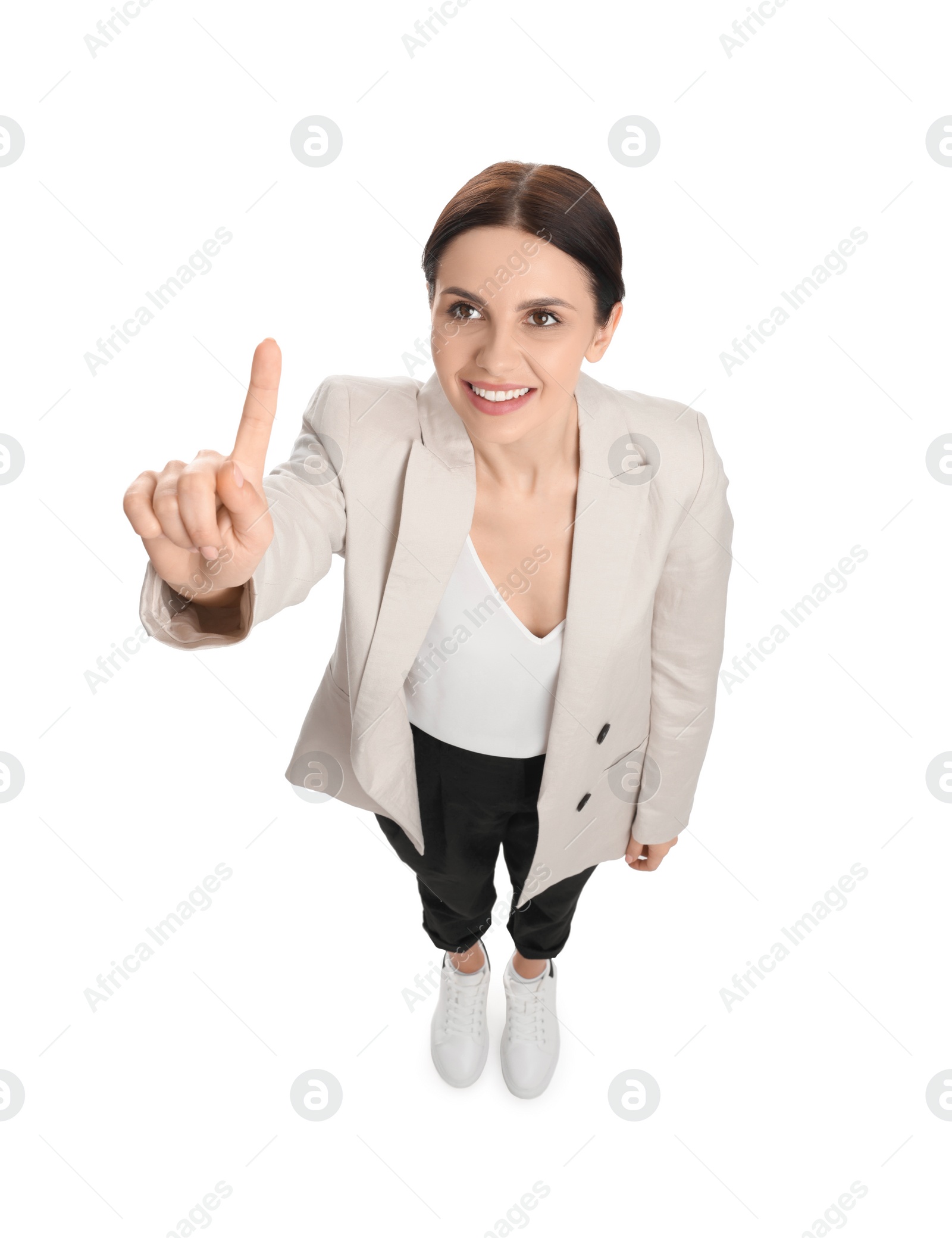 Photo of Beautiful businesswoman in suit pointing at something on white background, above view