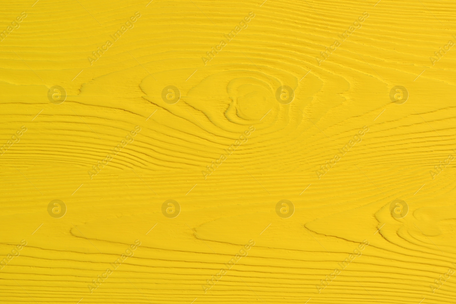 Photo of Texture of yellow wooden surface as background, closeup