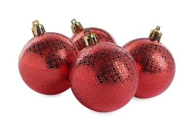 Photo of Beautiful shiny red Christmas balls on white background