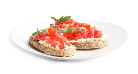 Photo of Plate of delicious tomato bruschettas on white background