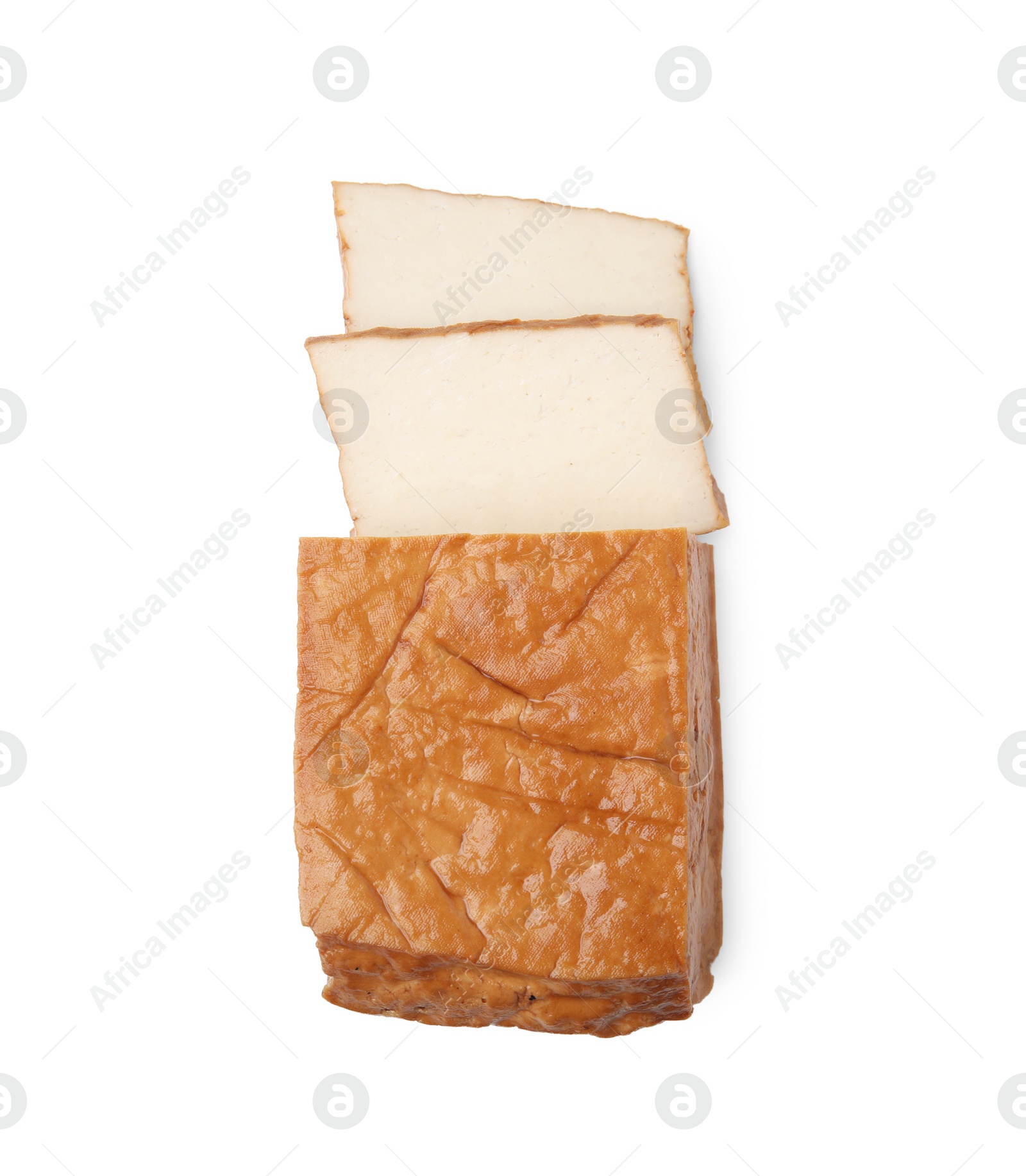 Photo of Cut smoked tofu cheese isolated on white, top view