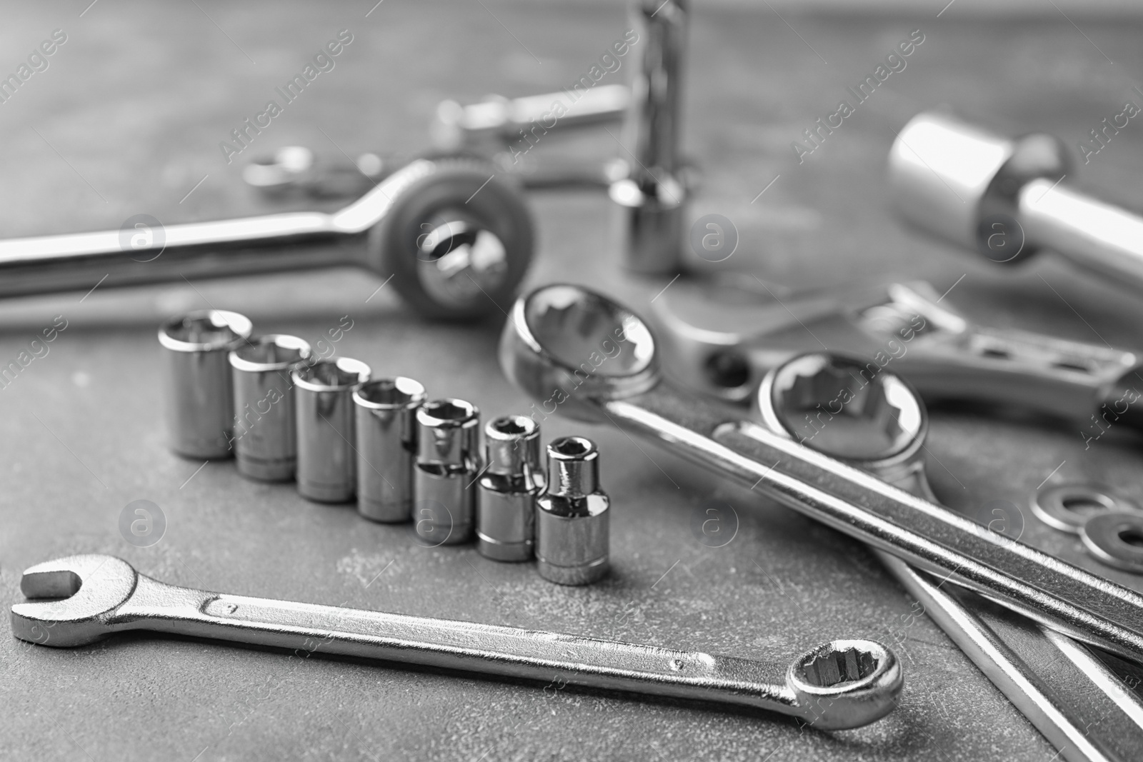 Photo of Auto mechanic's tools on grey stone table