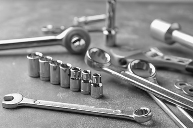 Photo of Auto mechanic's tools on grey stone table