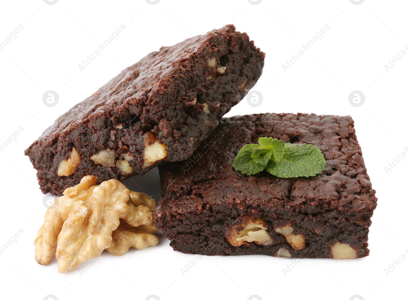 Photo of Delicious brownies with walnuts and mint on white background