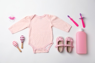 Photo of Flat lay composition with baby clothes and accessories on white background