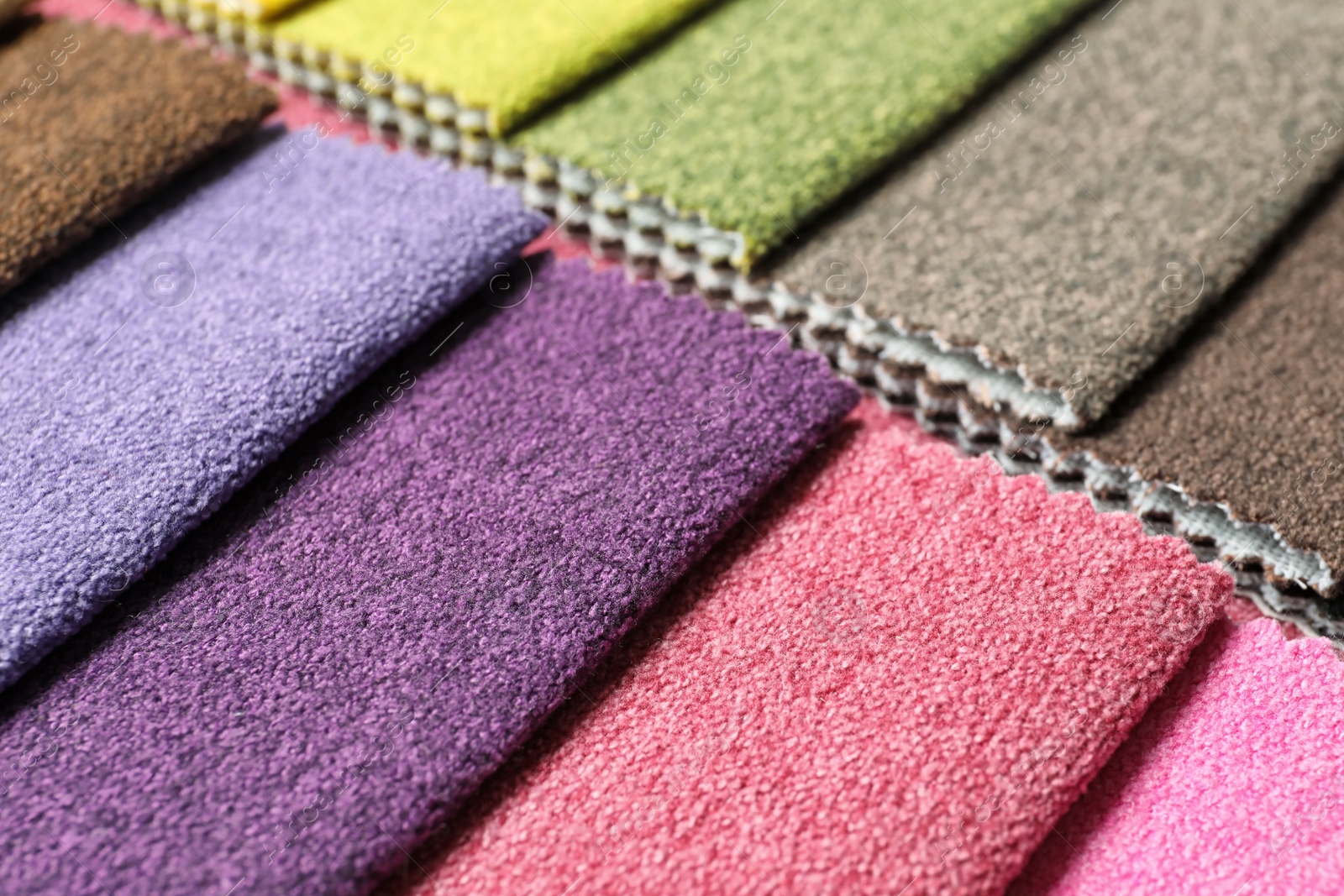 Photo of Fabric samples of different colors for interior design as background