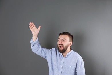 Portrait of handsome bearded man on color background