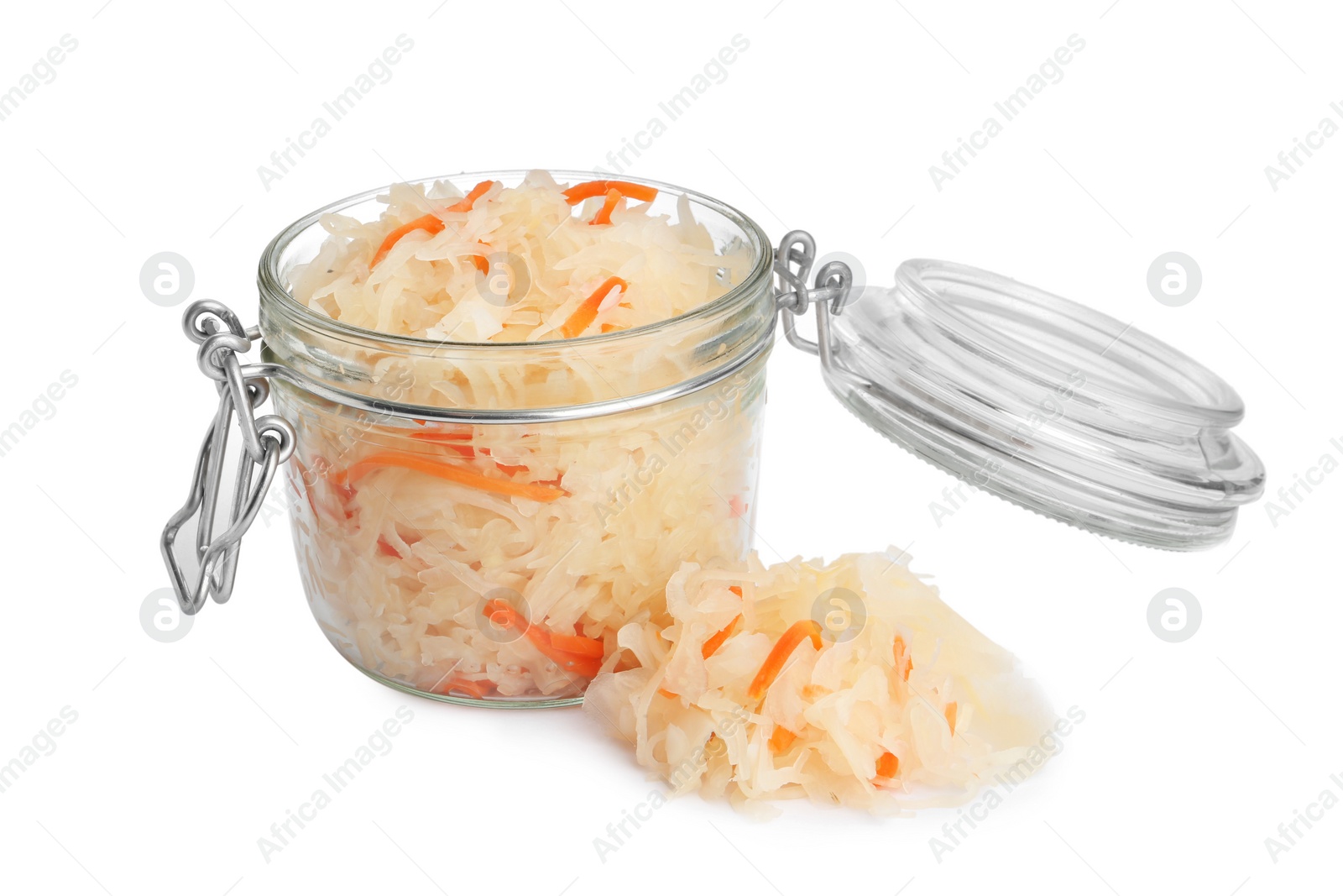 Photo of Glass jar of tasty fermented cabbage with carrot on white background