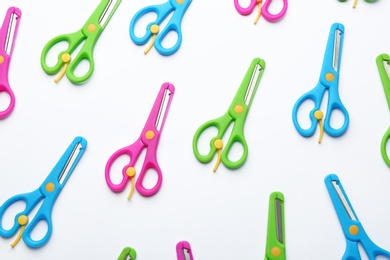 Photo of Set of training scissors on white background, top view