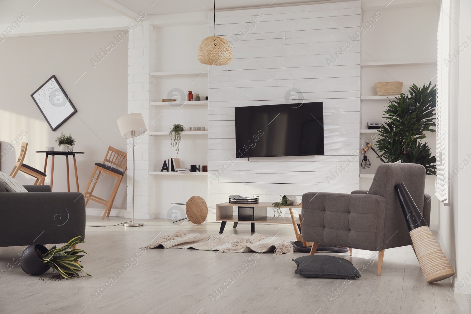 Photo of Chaotic living room interior after strong earthquake