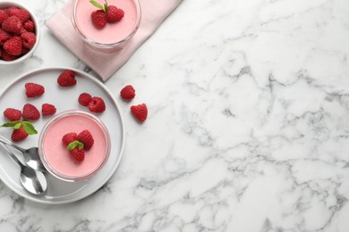 Photo of Delicious raspberry mousse with mint on white marble table, flat lay. Space for text