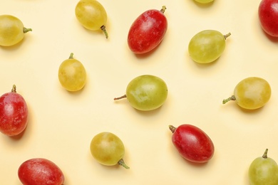 Photo of Fresh ripe juicy grapes on color background, top view