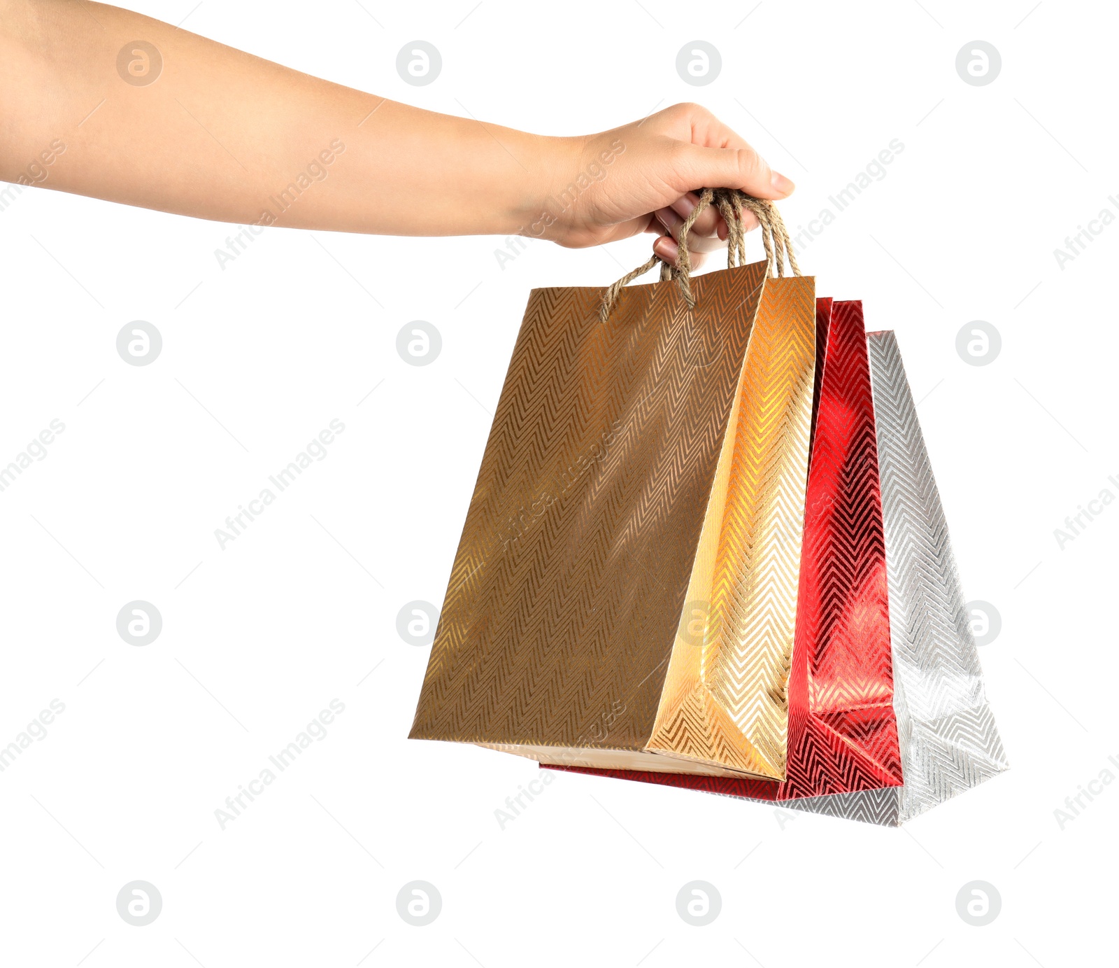 Photo of Woman holding paper shopping bags on white background, closeup. Space for design