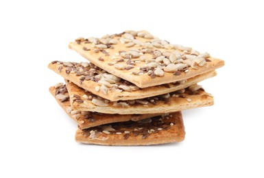 Photo of Stack of cereal crackers with flax, sunflower and sesame seeds isolated on white