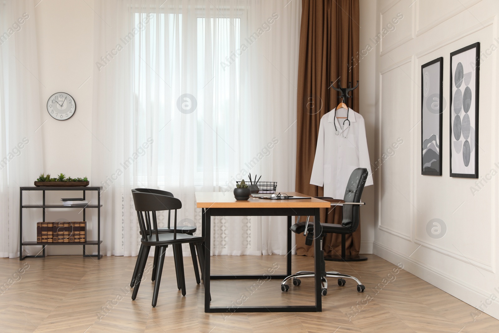 Photo of Modern medical office interior with doctor's workplace and chairs