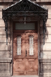 Photo of Closed vintage wooden door in old building