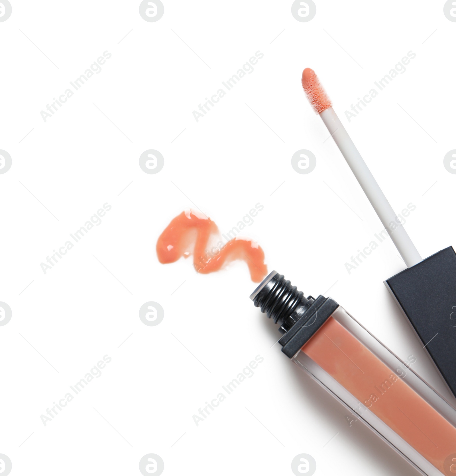 Photo of Beige liquid lipstick with smear and applicator isolated on white, top view. Space for text