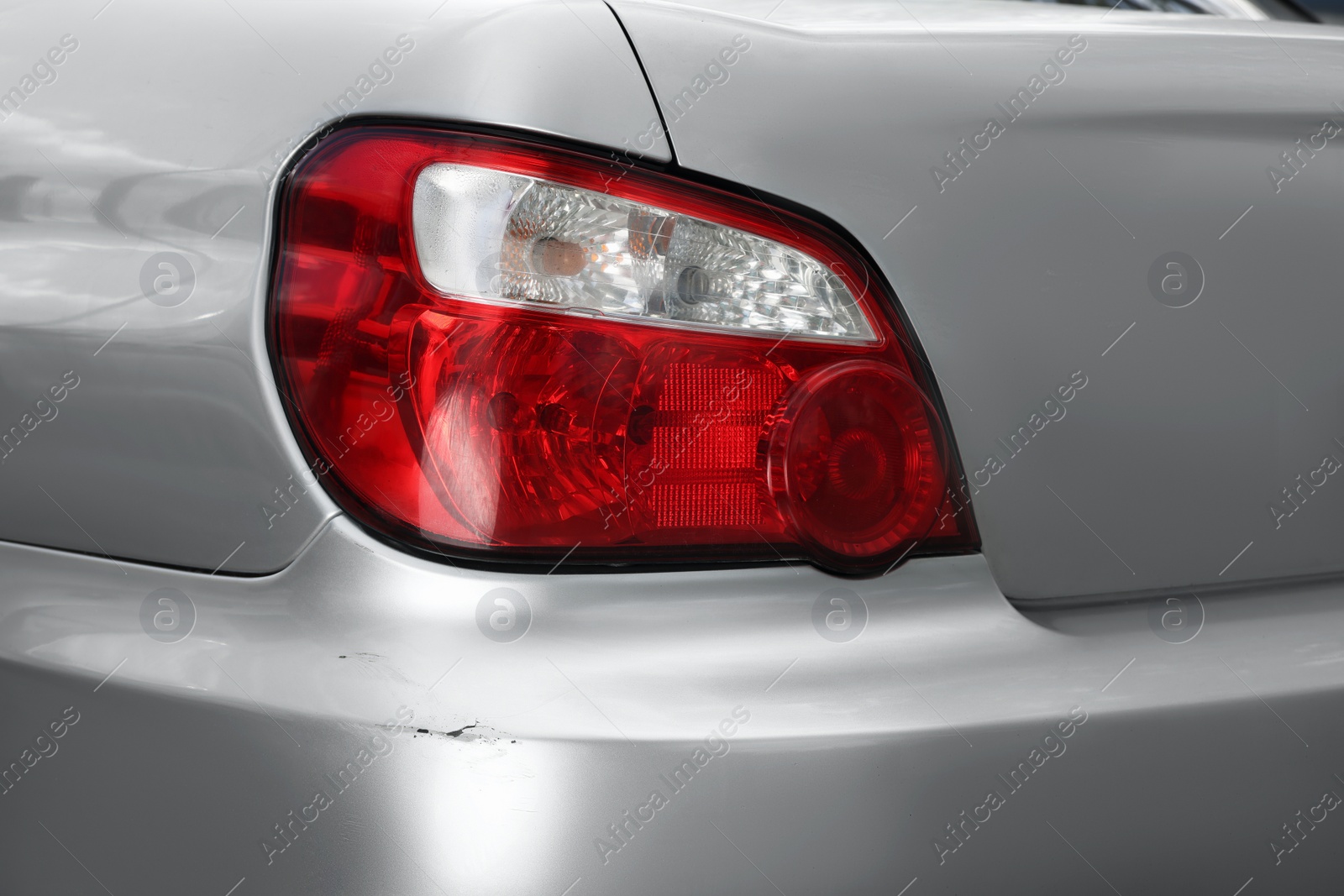 Photo of Modern gray car with scratch, closeup view