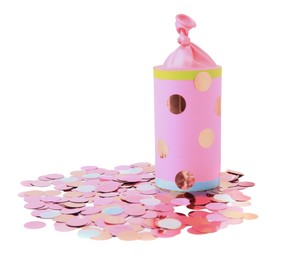 Photo of Colorful confetti with pink party cracker isolated on white
