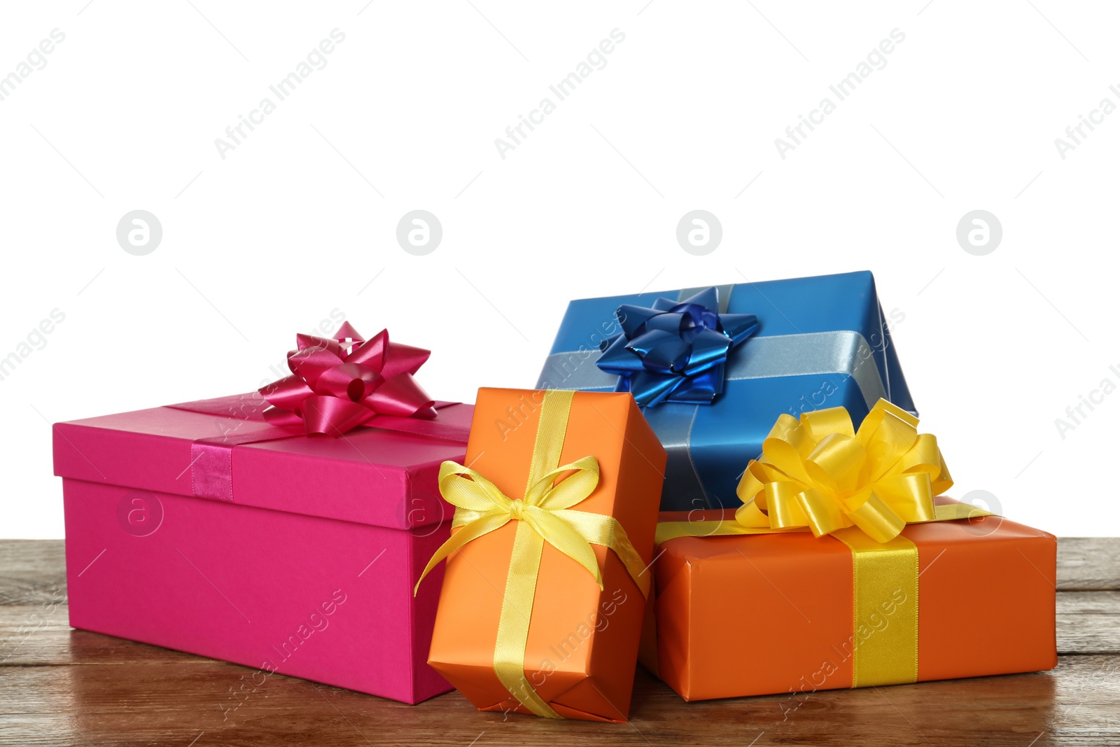 Photo of Colorful gift boxes on wooden table against white background