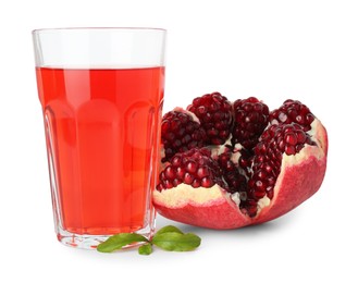 Photo of Refreshing pomegranate juice in glass, leaves and fruit isolated on white