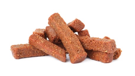 Photo of Pile of delicious crispy rusks on white background