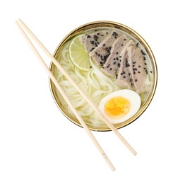 Photo of Bowl of delicious rice noodle soup with meat and egg isolated on white, top view