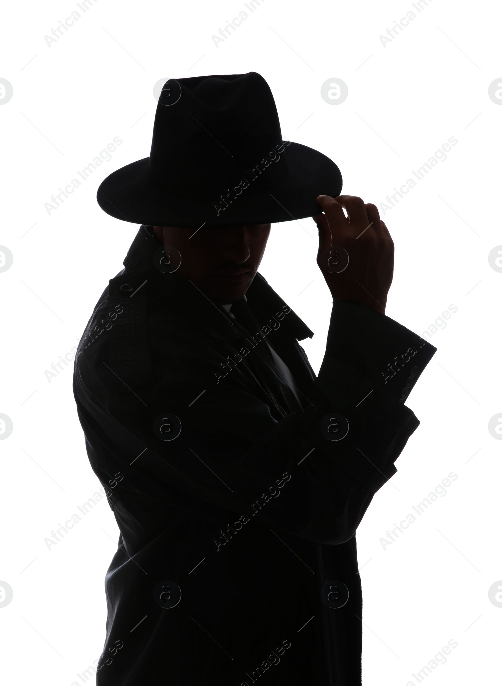 Photo of Silhouette of old fashioned detective on white background