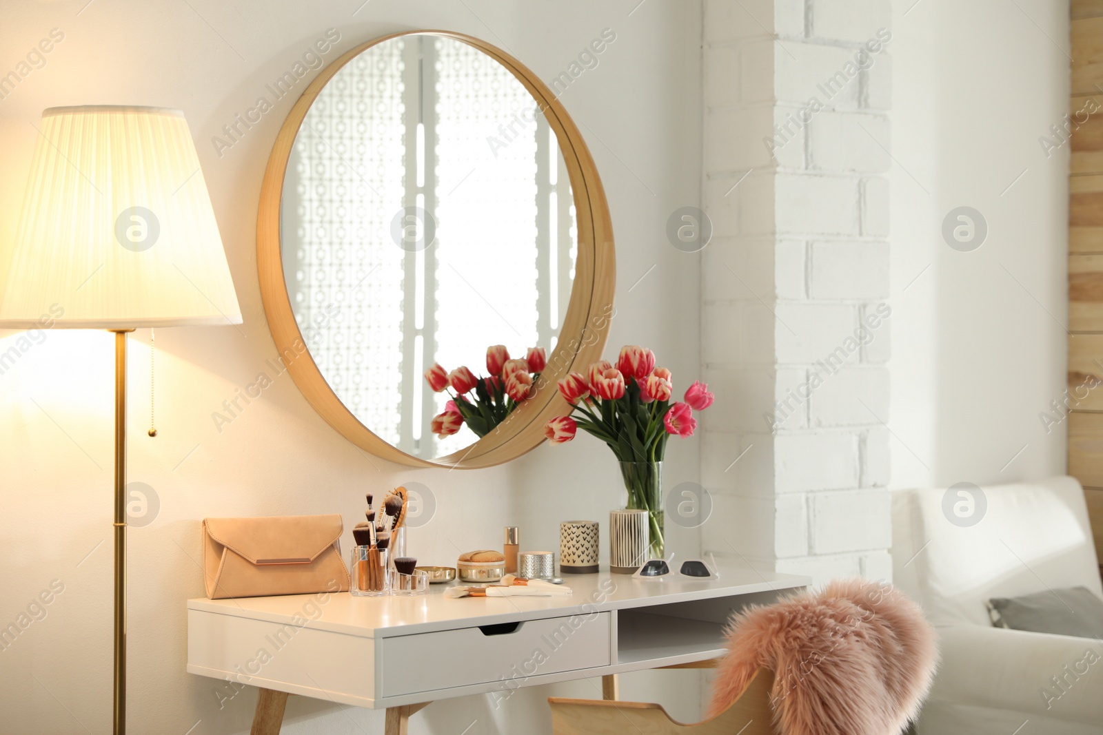 Photo of Stylish room interior with dressing table and mirror