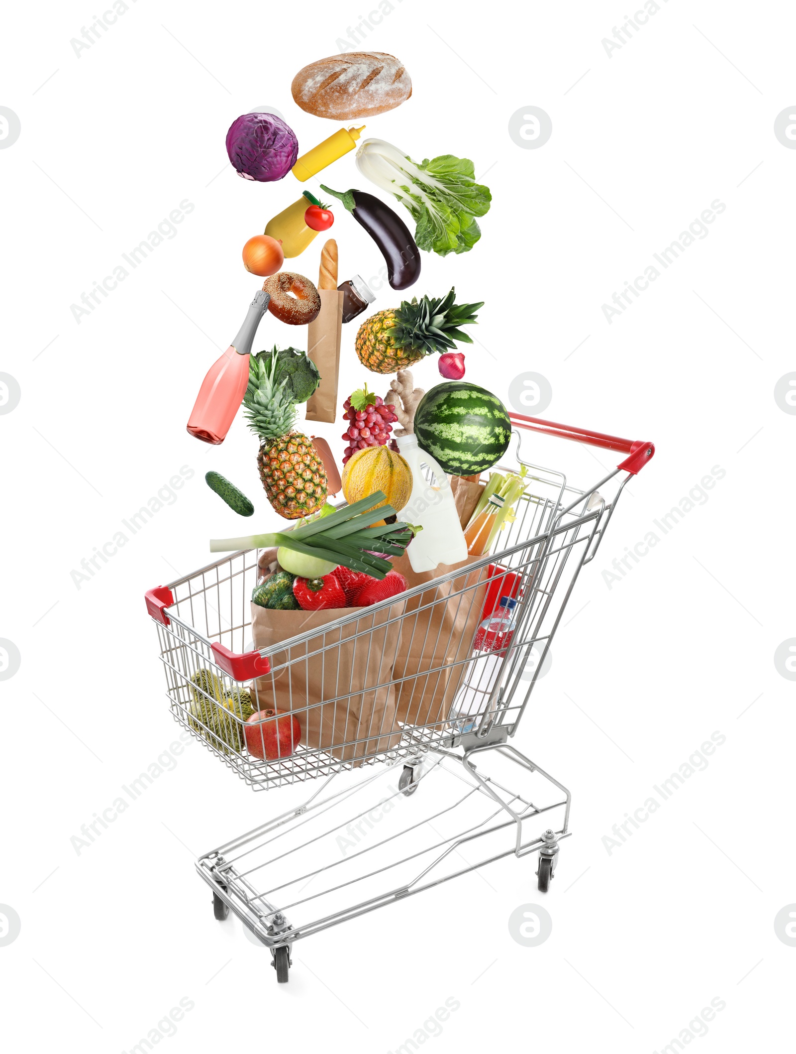 Image of Market assortment. Different products falling into shopping cart on white background