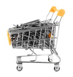 Photo of Metal nails in shopping cart isolated on white