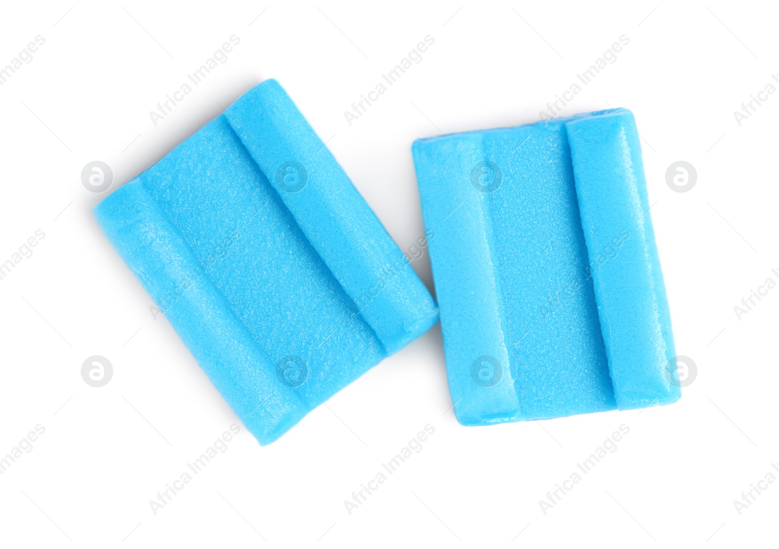 Photo of Tasty blue bubble gums isolated on white, top view
