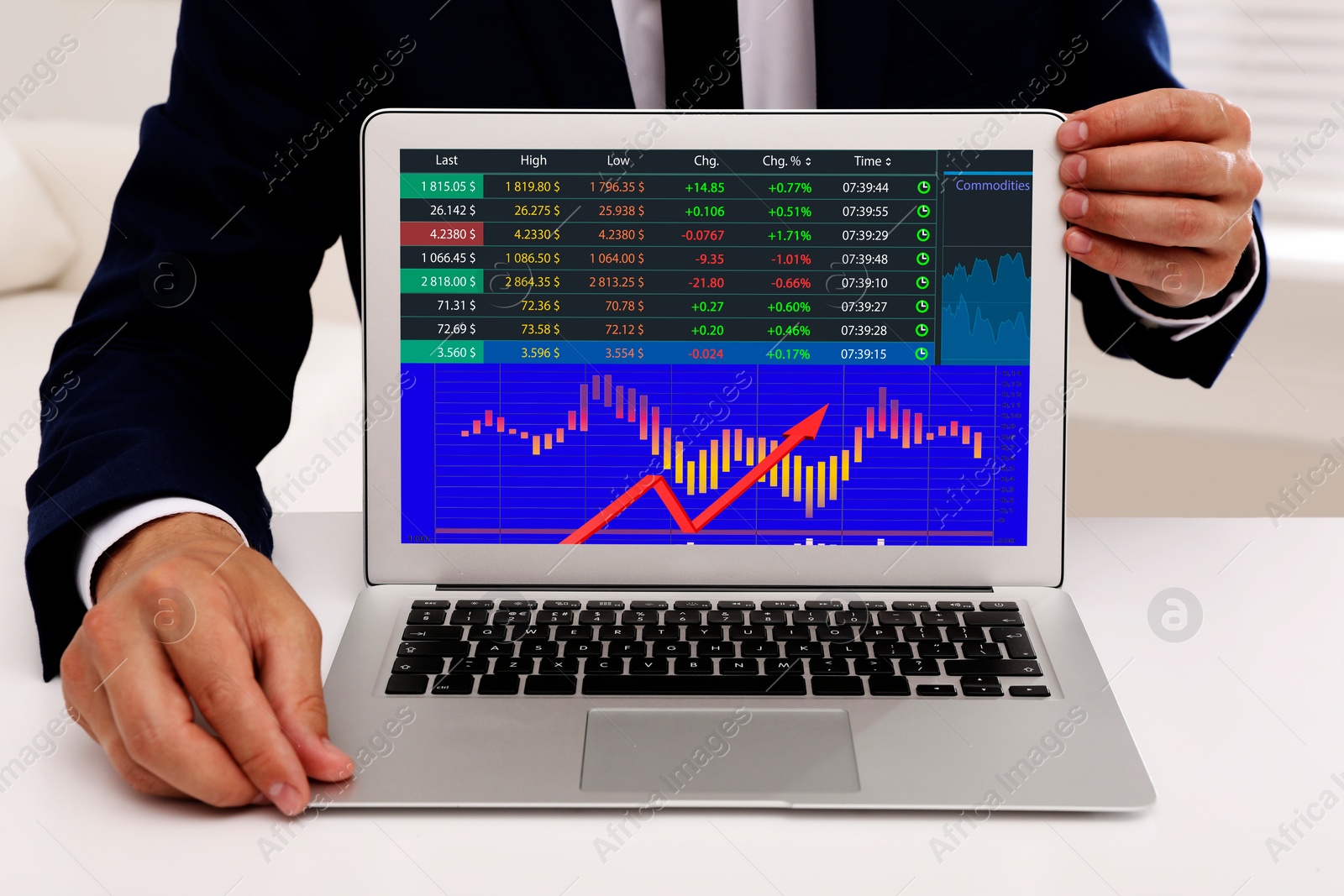 Image of Stock exchange. Man showing data and graph on screen via laptop, closeup