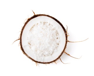 Coconut flakes in nut shell isolated on white, top view