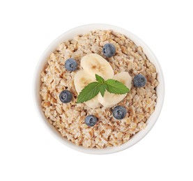 Photo of Tasty boiled oatmeal with blueberries and banana in bowl isolated on white, top view