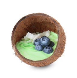 Photo of Tasty smoothie bowl with fresh blueberries in coconut shell isolated on white