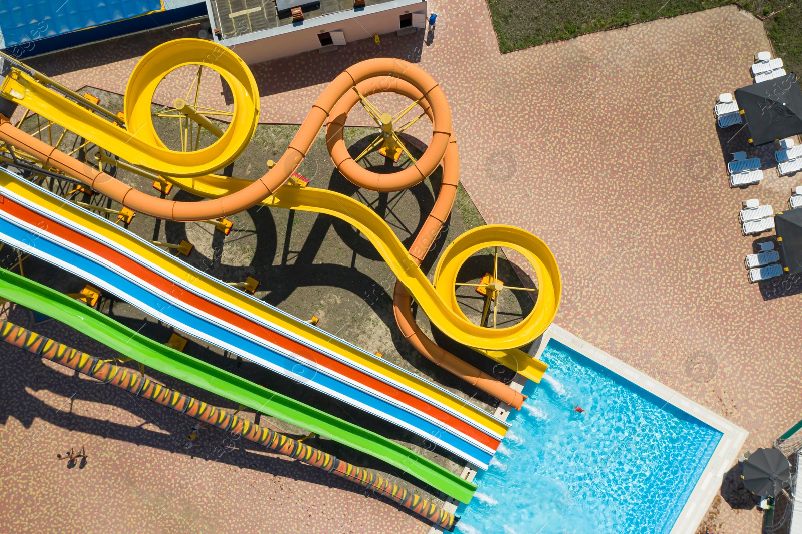 Image of Aerial view of water park on sunny day