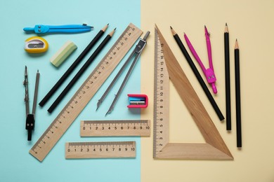 Flat lay composition with different rulers and compass on color background