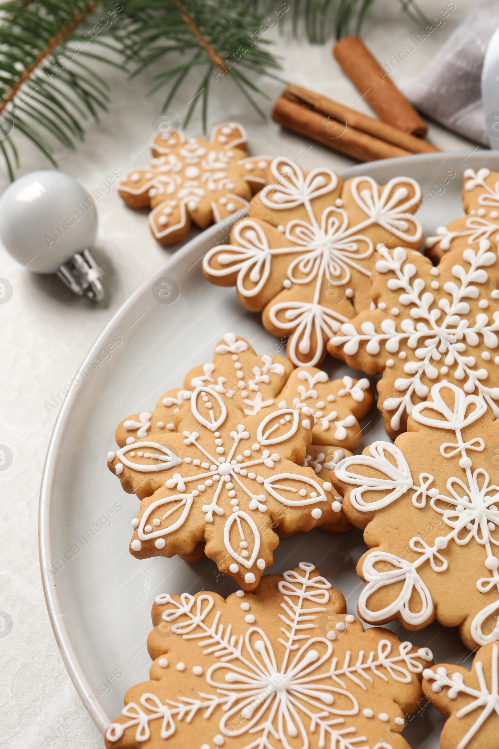 Photo of Tasty Christmas cookies on light table, closeup